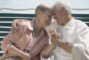 Senior Couple Relaxing in Deck Chairs